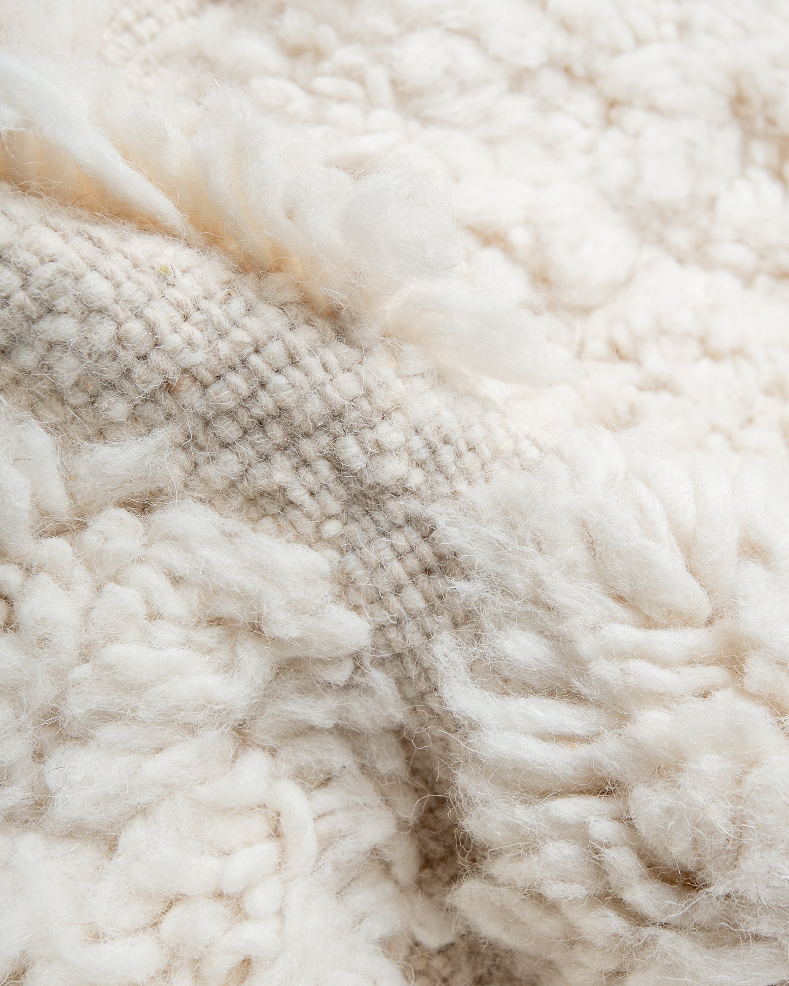 Modern, designer, handcrafted Berber rug from Morocco. Beniourain carpet with minimalist design, natural wool pile and a fluffy texture.